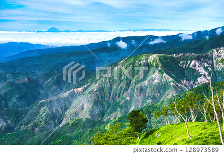 View of Ashio and Mt. Fuji in the distance from Yashiroyama in Oku-Nikko, Nikko, Tochigi Prefecture 128973589