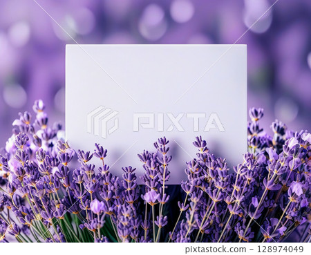 Delicate lavender flowers bloom vibrantly, framing a blank card waiting for heartfelt messages or creative ideas. The soft colors evoke a dreamy, tranquil atmosphere Generative AI 128974049