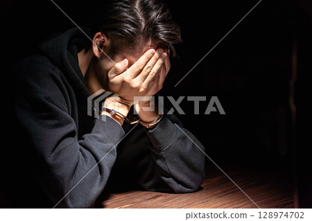 Criminal handcuffs interrogation 128974702