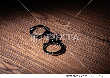 Arrest handcuffs 128974705