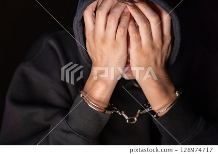 Criminal handcuffs interrogation 128974717