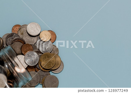 Spilled Thai Baht Coins on Blue, Finance and Saving Spilled Thai Baht Coins on Blue, Finance and Saving 128977249