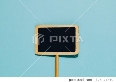 Blank Mini Chalkboard Sign on Blue, Message and Promotion 128977250