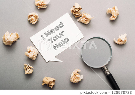 a pile of paper with the words I need your help a pile of paper with the words I need your help 128978728