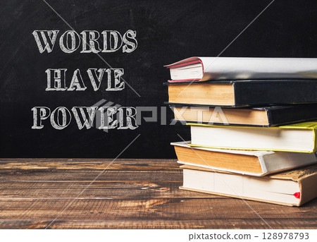 A stack of books with the words words have power written on top 128978793