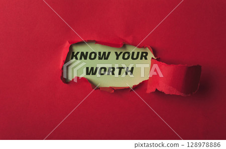 Red background with a torn piece of paper that says Know Your Worth 128978886