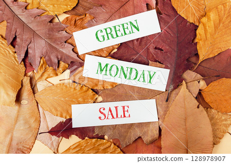 Pile of autumn leaves with the words Green Monday Sale written on them 128978907