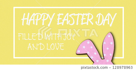 Yellow background with a pink bunny on it 128978963