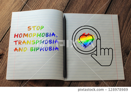 Notebook is open to a page with a rainbow heart and the words Stop Homophobia 128978989