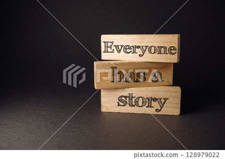 Three wooden blocks stacked on top of each other with the words "everybody has a 128979022