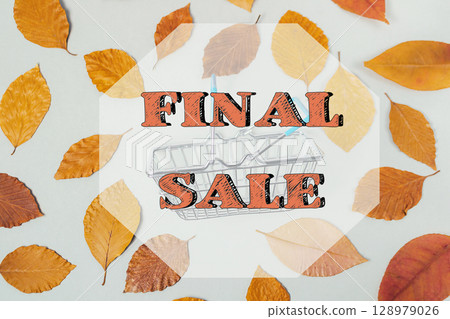 A close up of autumn leaves with the words "Final Sale" written in orange 128979026