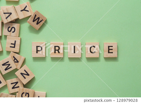 A jumble of wooden letters spell out the word price A jumble of wooden letters spell out the word price 128979028