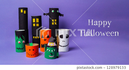 Bunch of paper tubes with Halloween faces on them Bunch of paper tubes with Halloween faces on them 128979133