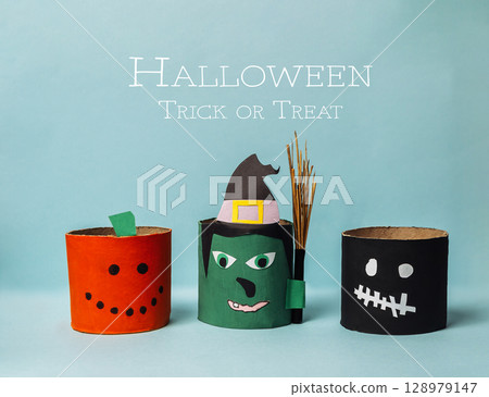 Three Halloween themed paper lanterns with a witch, a pumpkin and a skeleton 128979147