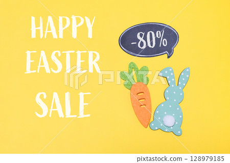 Yellow background with a carrot and a rabbit on it Yellow background with a carrot and a rabbit on it 128979185