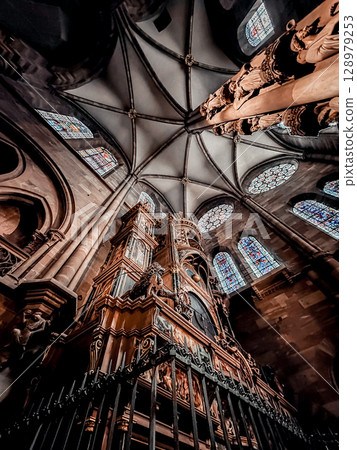 Cathedral with a large organ and stained glass windows Cathedral with a large organ and stained glass windows 128979253