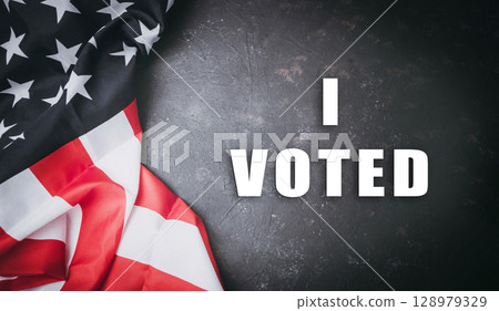 Red and white American flag with the words I Voted written underneath it 128979329