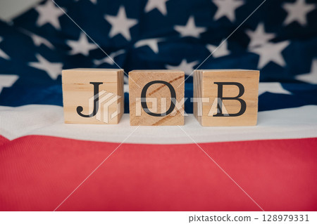 Wooden block with the letters JOB written on it Wooden block with the letters JOB written on it 128979331