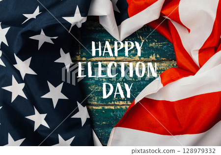 Flag with stars and stripes is displayed with the words Happy Election Day Flag with stars and stripes is displayed with the words Happy Election Day 128979332