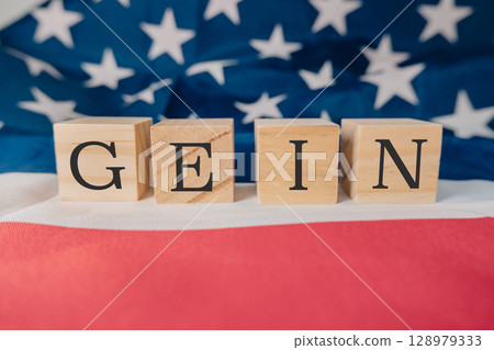 Wooden block with the letters Gein written on it Wooden block with the letters Gein written on it 128979333