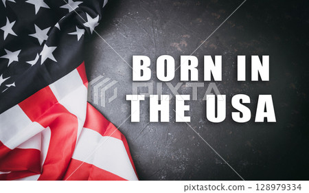 The flag is on a black background The flag is on a black background 128979334