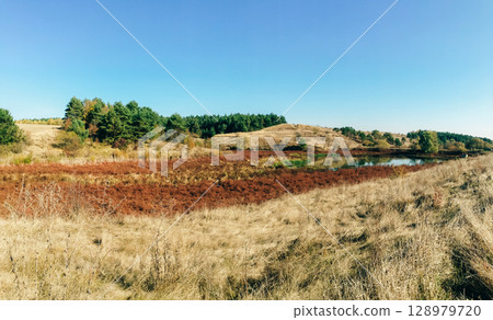 Field with a river running through it Field with a river running through it 128979720