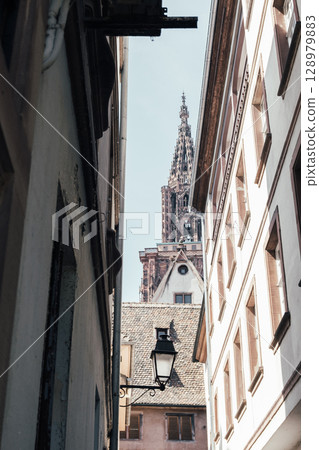 Street with a tall building in the background Street with a tall building in the background 128979883
