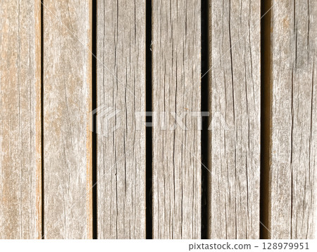 The image is of a wooden surface with a grainy texture The image is of a wooden surface with a grainy texture 128979951