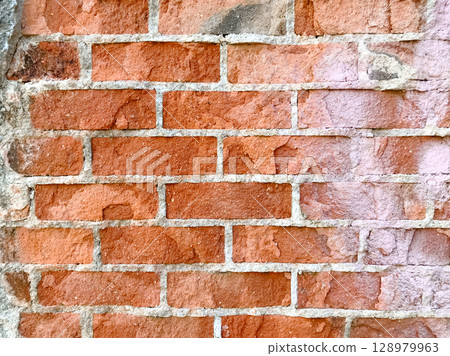 A brick wall with a white line in the middle A brick wall with a white line in the middle 128979963