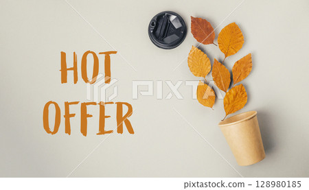 Cup of coffee with a leaf on top of it Cup of coffee with a leaf on top of it 128980185