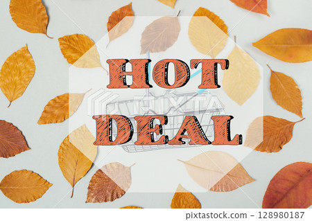 Picture of autumn leaves with the words HOT DEAL written in orange 128980187