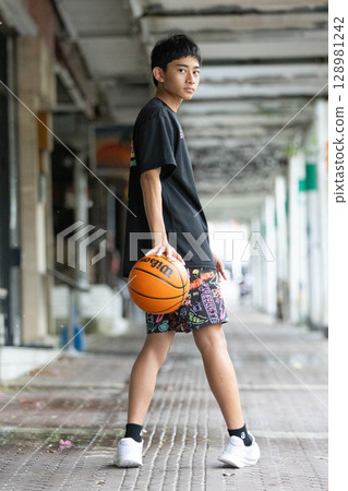 Boy with basketball Boy with basketball 128981242