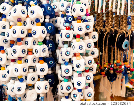 Colorful evil eye beads displayed in a market stall 128982684