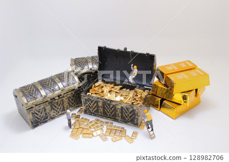 Workers Exploring Treasure Chests Overflowing With Gold Bars 128982706