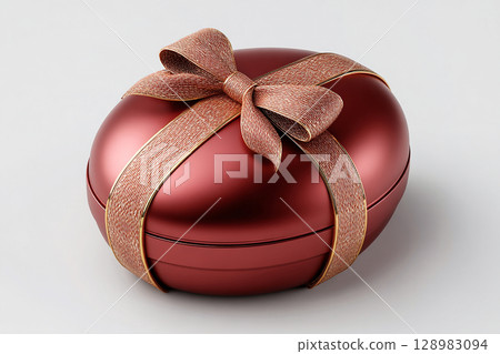 Red packaging. Seasonal decor. Easter egg shaped gift box on white background. Easter traditions. 128983094