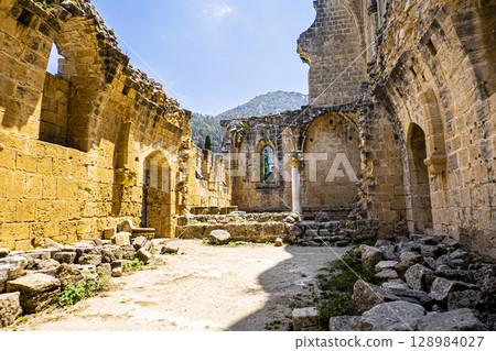 Photo of the collapsed gothic walls of the Bella Pais Monastery and the Kyrenia Mountains in Turkish Republic of Northern Cyprus 128984027