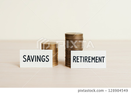 Savings retirement concept with stacked coins and budget plan for future financial security and retirement plan Savings retirement concept with stacked coins and budget plan for future financial security and retirement plan 128984549