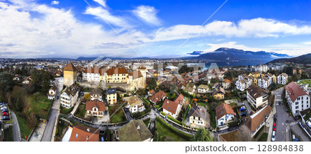 France travel and landmarks. Romantic beautiful old town of Annecy, aerial drone panoramic view with medieval castle. 128984838