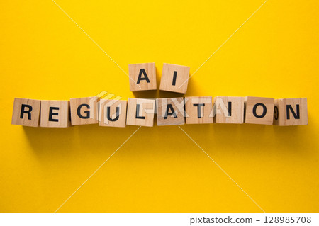 Ai regulation concept with wooden cubes on yellow background 128985708