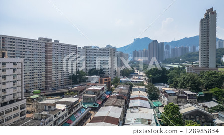 July 26 2025 Urban Neighborhood with Buildings and Market Stalls 128985834