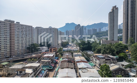 July 26 2025 Urban Neighborhood with Buildings and Market Stalls 128985840