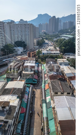 July 26 2025 Urban Neighborhood with Buildings and Market Stalls July 26 2025 Urban Neighborhood with Buildings and Market Stalls 128985855