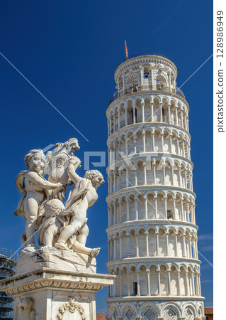 The famous Leaning Tower with statues of angels in the foreground. 128986949
