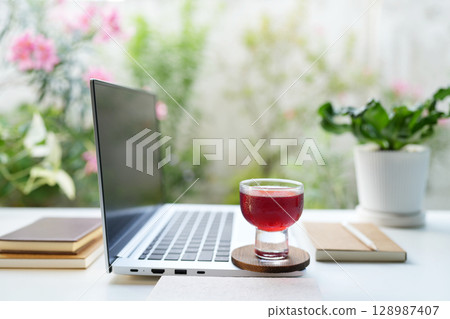 laptop and Roselle juice, relaxed work space 128987407