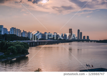 Yeouido, the financial district of Seoul, Korea, and the surrounding city scenery taken during the summer sunset 128988747