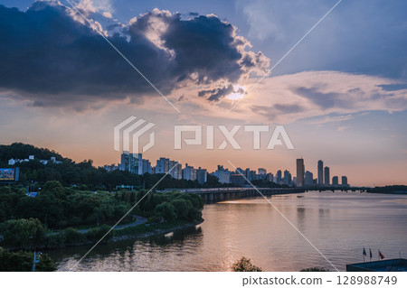 Yeouido, the financial district of Seoul, Korea, and the surrounding city scenery taken during the summer sunset Yeouido, the financial district of Seoul, Korea, and the surrounding city scenery taken during the summer sunset 128988749