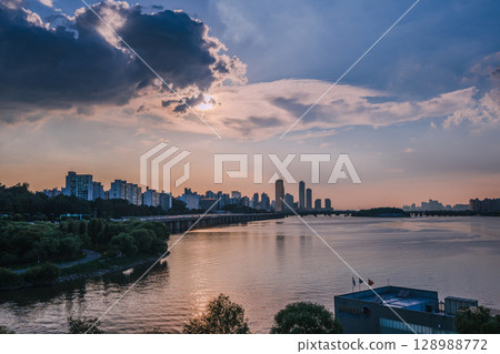 Yeouido, the financial district of Seoul, Korea, and the surrounding city scenery taken during the summer sunset 128988772