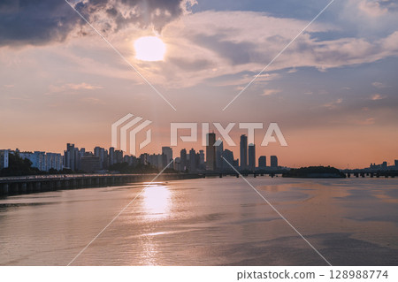 Yeouido, the financial district of Seoul, Korea, and the surrounding city scenery taken during the summer sunset 128988774