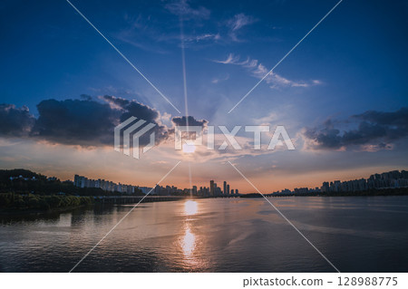 Yeouido, the financial district of Seoul, Korea, and the surrounding city scenery taken during the summer sunset Yeouido, the financial district of Seoul, Korea, and the surrounding city scenery taken during the summer sunset 128988775