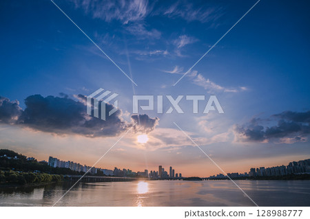 Yeouido, the financial district of Seoul, Korea, and the surrounding city scenery taken during the summer sunset 128988777